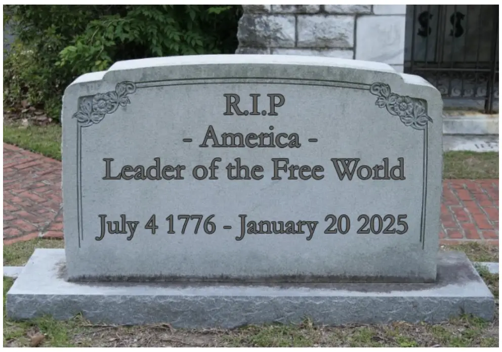 A gray tombstone in a cemetery with engraved text reading 'R.I.P. - America - Leader of the Free World' and dates 'July 4…