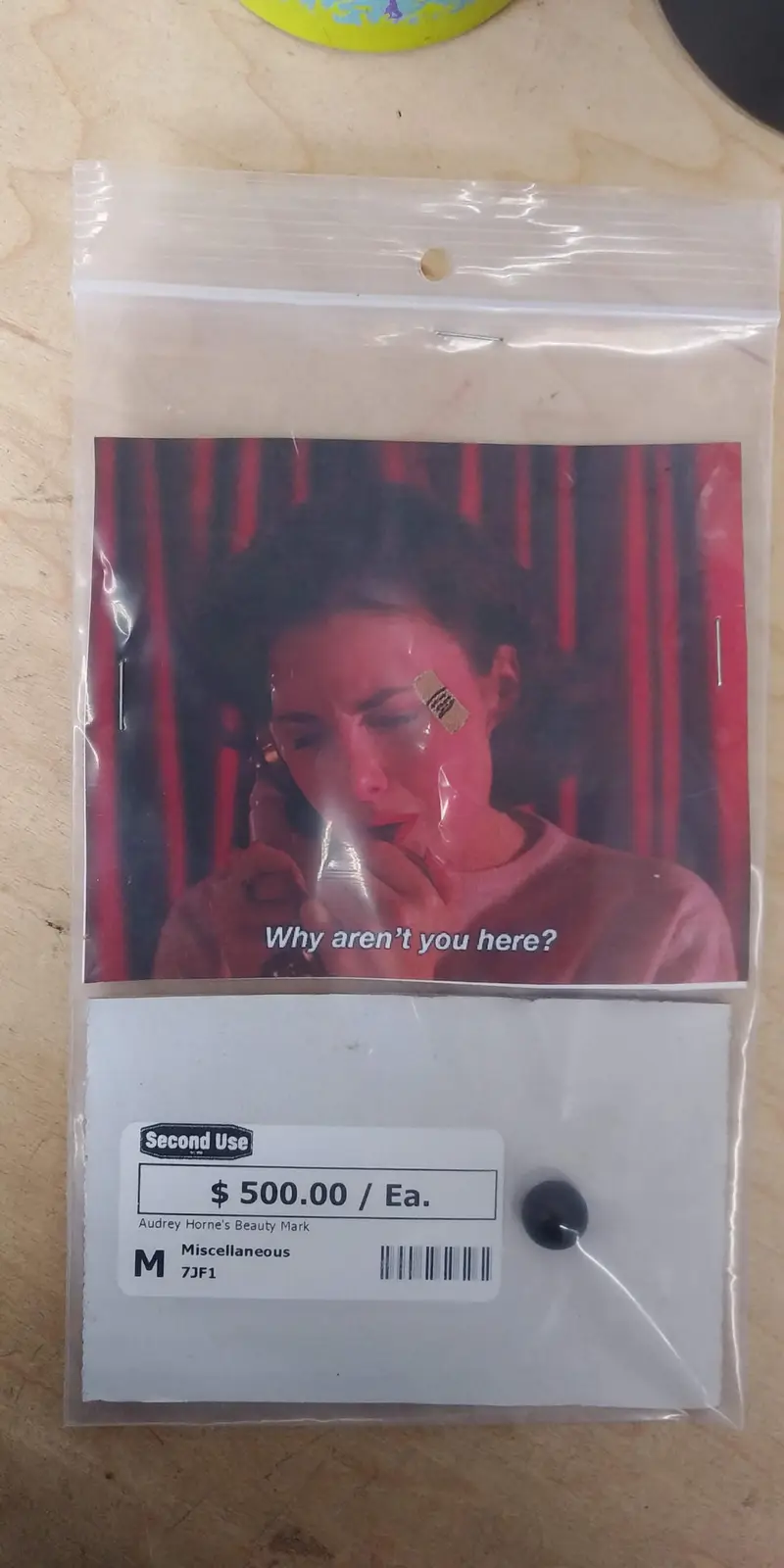 A clear plastic bag contains a small black button and a label reading 'Second Use $500.00 / Ea. Audrey Horne's Beauty Mark…