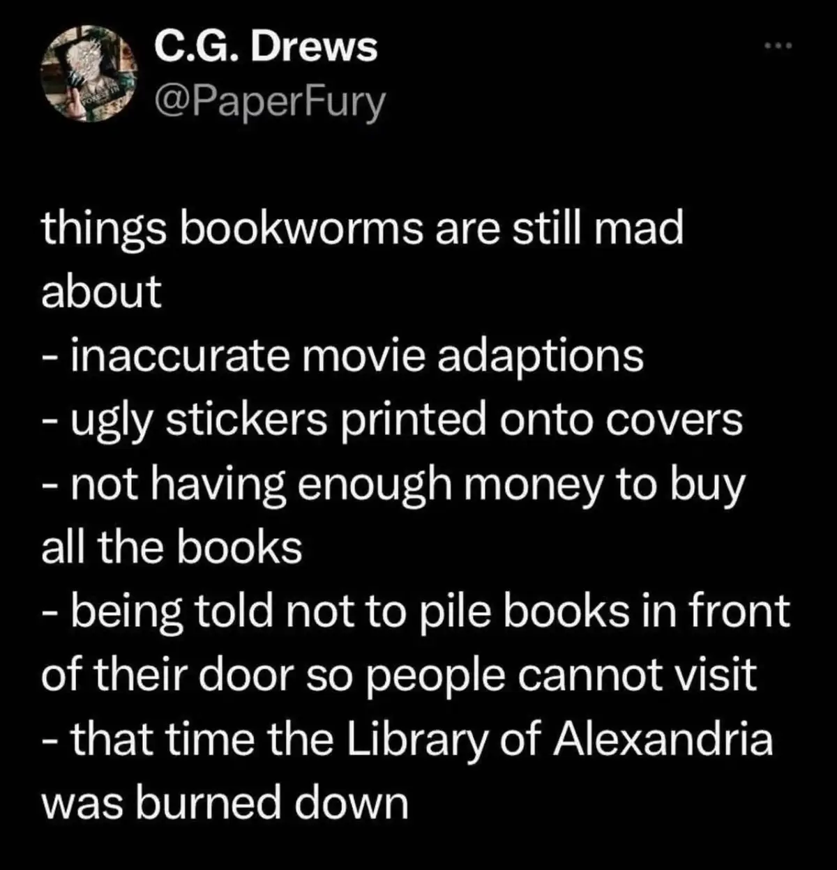 A black-background image displays a tweet from user C.G. Drews (@PaperFury) listing 'things bookworms are still mad about,'…