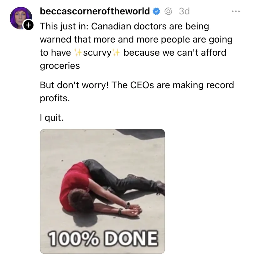 A person in a red shirt and black pants lies face-down on a concrete surface, arms extended forward, appearing exhausted…