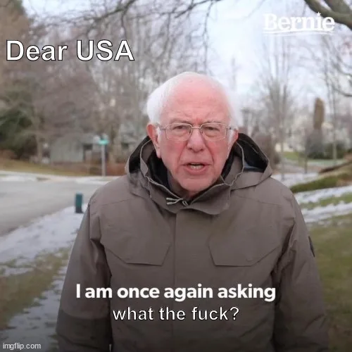 A man with white hair and glasses, wearing a brown hooded jacket, stands outdoors in a snowy residential area. The text…