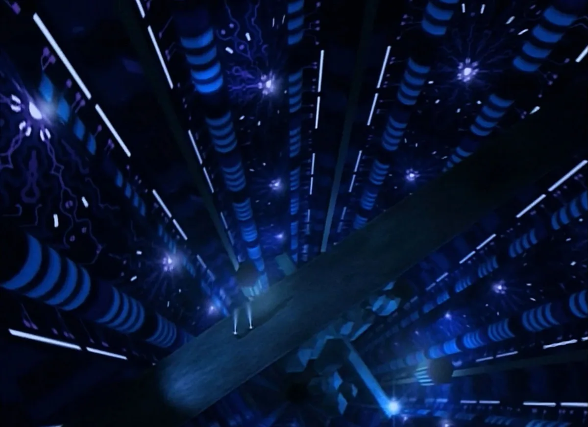 A low-angle shot shows a lone figure standing on a narrow platform in a vast, dark, futuristic corridor with glowing blue…
