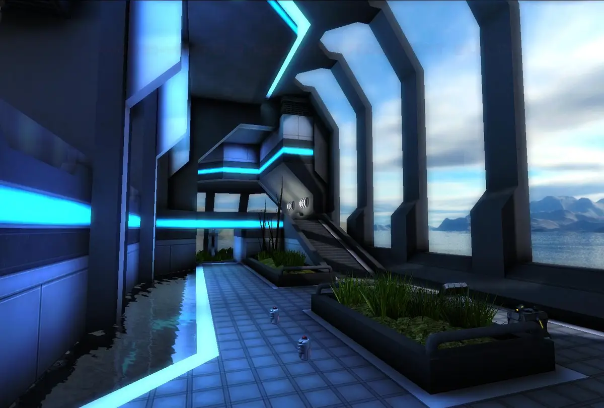 A screenshot from a video game shows a futuristic, blue-lit corridor with a flooded floor and two small robot-like figures…
