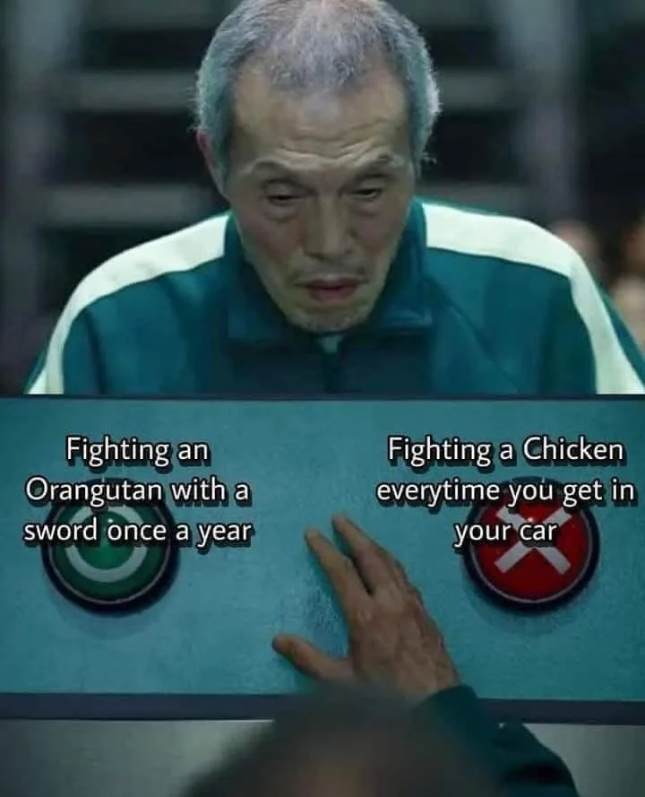 A man in a green and white tracksuit looks down at a control panel with two circular buttons. His hand is hovering over the…
