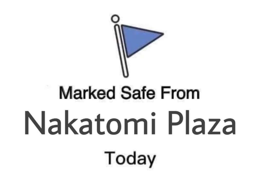 A simple graphic shows a blue triangular flag on a pole, with text below stating 'Marked Safe From Nakatomi Plaza Today'…
