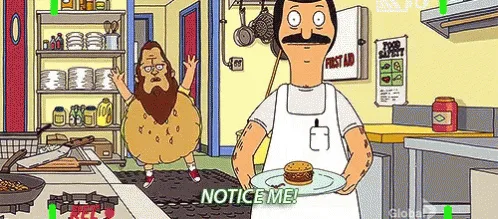 Two animated characters are in a kitchen. One, a man with a mustache and apron, holds a plate with a burger. The other, a…