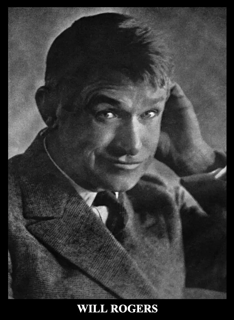 A black-and-white portrait of Will Rogers, a famous American humorist and actor, looking directly at the camera with a…