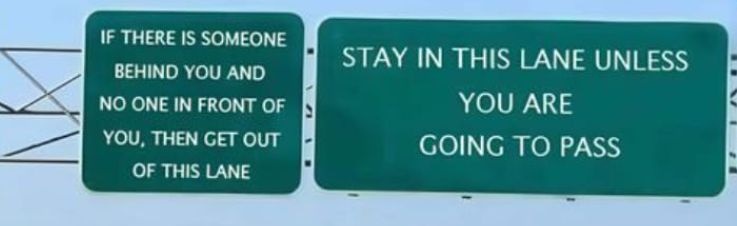 Two green highway signs are mounted side-by-side. The left sign reads: 'IF THERE IS SOMEONE BEHIND YOU AND NO ONE IN FRONT…