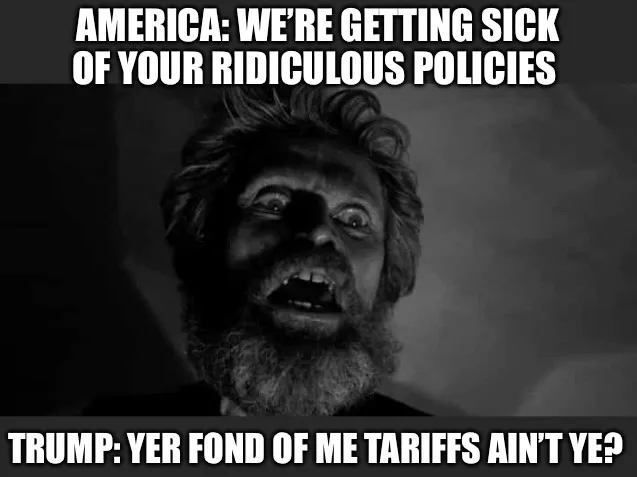 A black-and-white image shows a man with wild hair and a beard, mouth open in an exaggerated expression of outrage or shock…