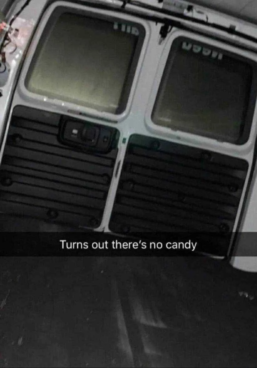 The image shows the interior of a vehicle, likely a van or truck, with a view of the rear window area. The windows are…