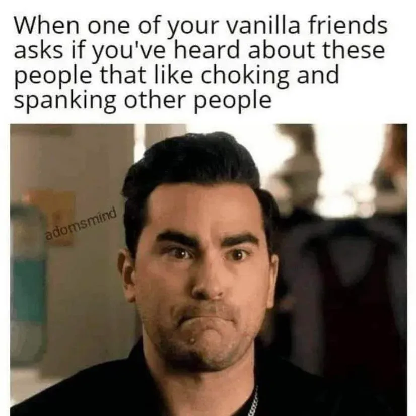 The image shows a man with a confused and slightly disgusted facial expression, looking directly at the viewer. The overlaid…