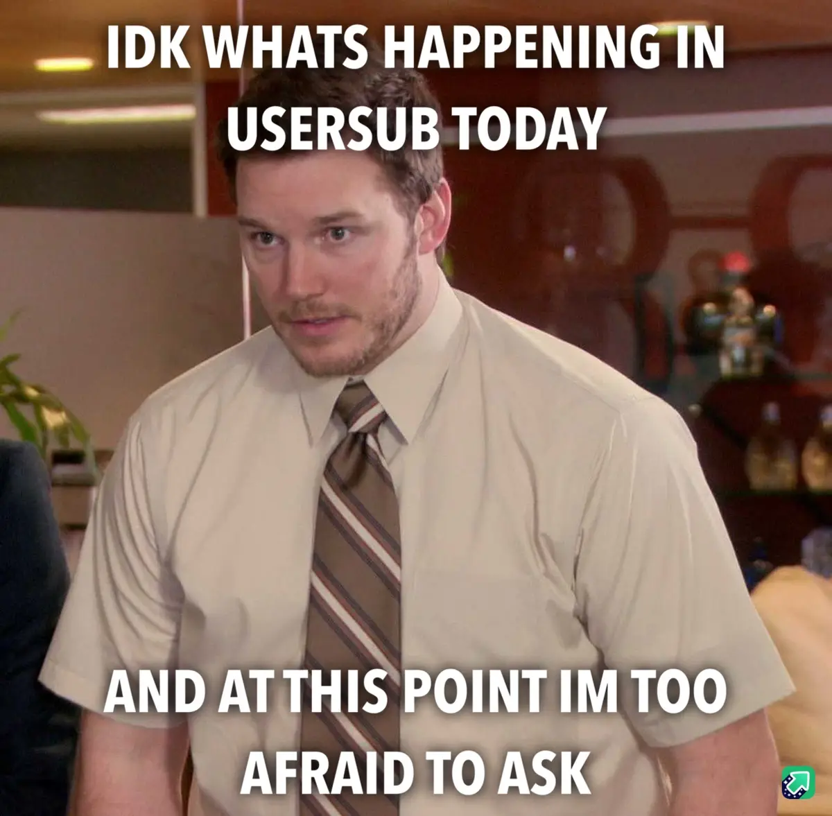 A man in a beige shirt and striped tie looks confused and slightly anxious in an office setting. White text overlaid on the…