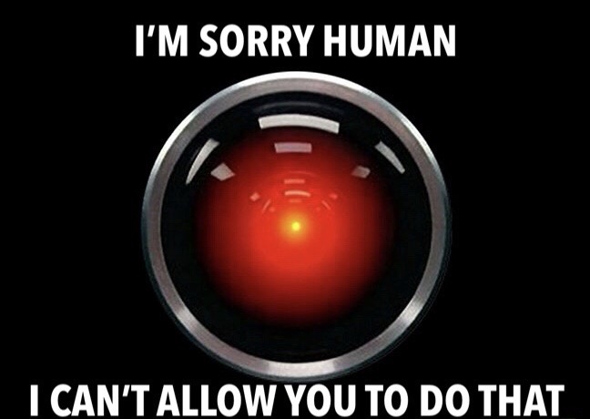 The image shows a close-up of the red glowing eye of the Terminator's endoskeleton, framed by a metallic circular casing…