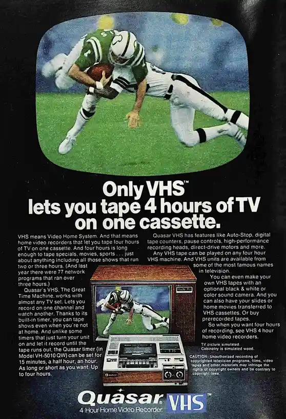 A vintage Quasar VHS advertisement features a football player in a green and white uniform diving for the ball on a TV…