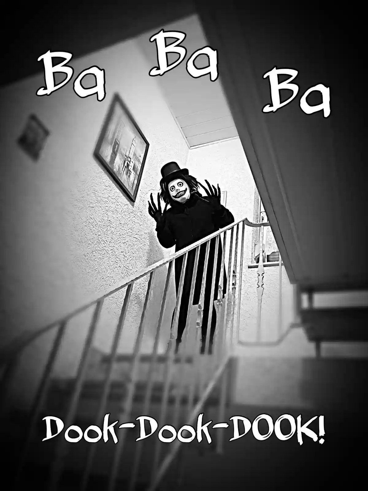 A black-and-white photo shows a person in a scary clown costume with a top hat, standing on a staircase railing and holding…