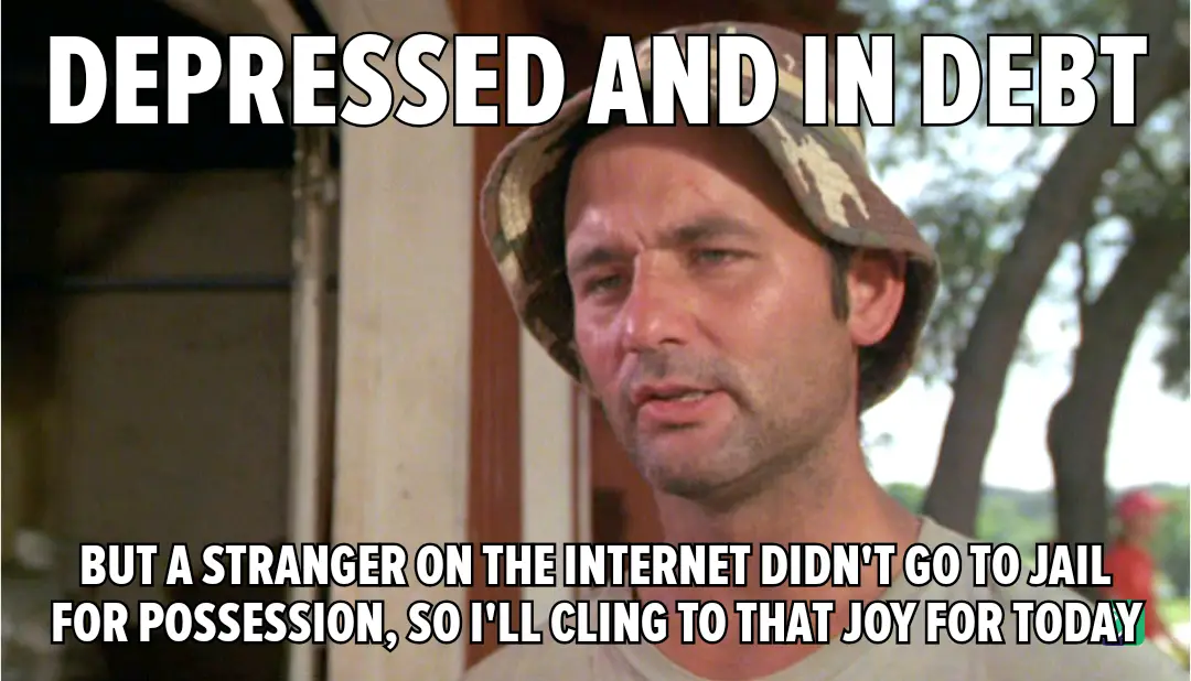 A man wearing a camouflage bucket hat looks weary and defeated. The text overlaid on the image reads 'DEPRESSED AND IN DEBT'…