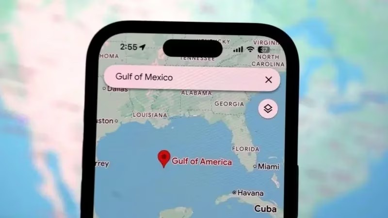 A smartphone screen displays a map app with 'Gulf of Mexico' typed in the search bar, but the map shows a red pin labeled…