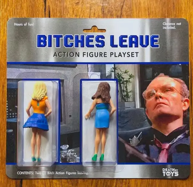 An action figure playset package labeled 'BITCHES LEAVE ACTION FIGURE PLAYSET' shows two plastic female figures with their…
