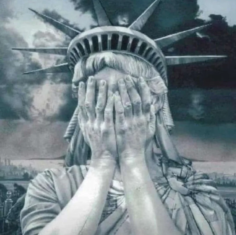 The Statue of Liberty is depicted with both hands covering her face, obscuring her eyes and nose, while her crown and…
