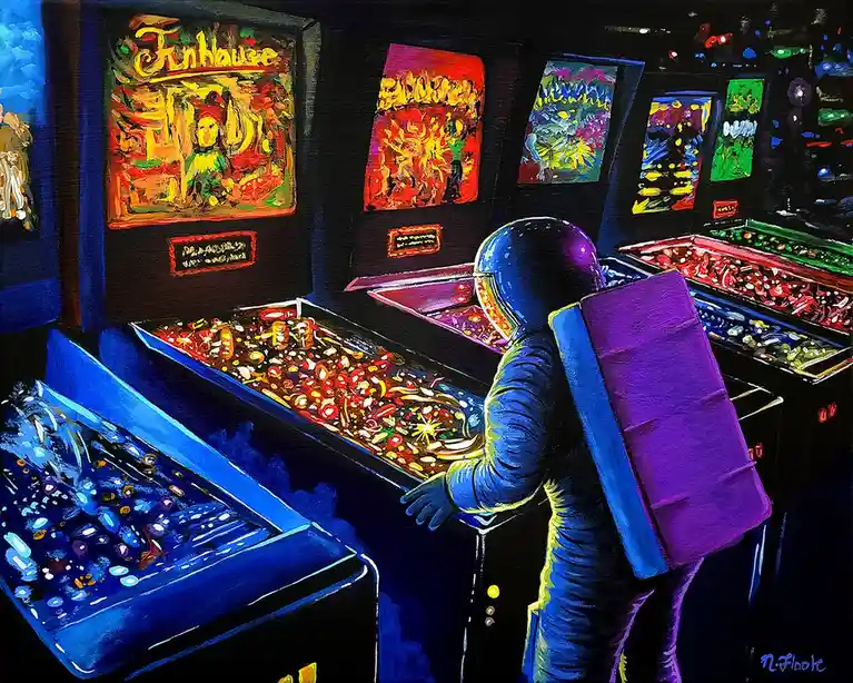 A person in a full astronaut suit with a purple oxygen tank stands in front of a row of colorful, lit-up pinball machines in…
