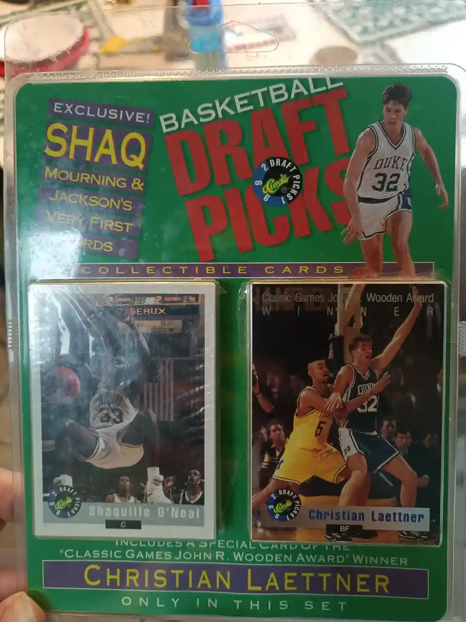 A vintage 1992 'Basketball Draft Picks' collectible card pack featuring Shaquille O'Neal and Christian Laettner, with the…