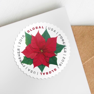 A circular U.S. postage stamp featuring a red poinsettia flower with green leaves, bordered by the text 'GLOBAL USA FOREVER…