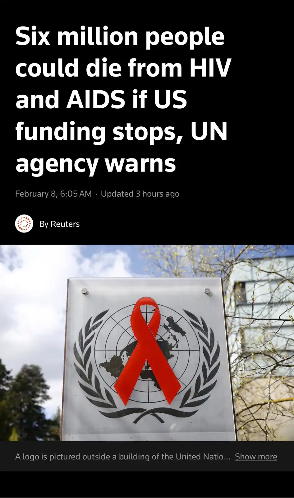 The image displays a news headline overlaying a photo of a sign featuring a red ribbon over a world map, flanked by laurel…