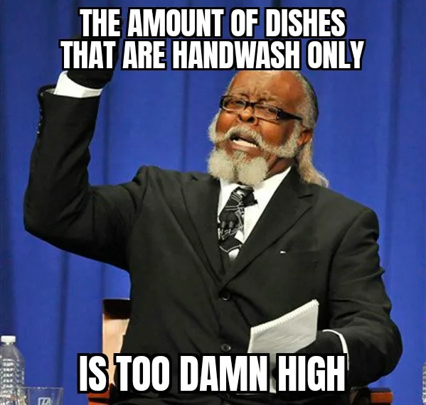 A man in a black suit and glasses, with a white beard, raises his right arm in frustration while holding papers in his left…