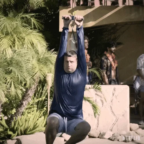 A man in a blue shirt and shorts is shown in a six-panel grid, progressively pulling himself up on a rope until he is fully…