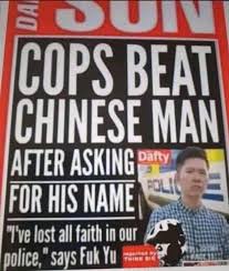 A newspaper front page from the Daily Sun with bold black text announcing 'COPS BEAT CHINESE MAN AFTER ASKING FOR HIS NAME'…