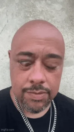 A six-panel image shows a bald man with a goatee and chain necklace against a concrete wall, progressively making…