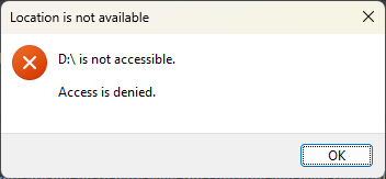 A computer error dialog box shows 'Location is not available' at the top, with an orange X icon. Below, it states 'D:\ is…