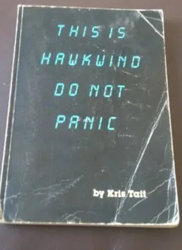 A worn, cracked book cover with glowing teal text reads 'THIS IS HAWKWIND DO NOT PANIC' and 'by Kris Tait' at the bottom…