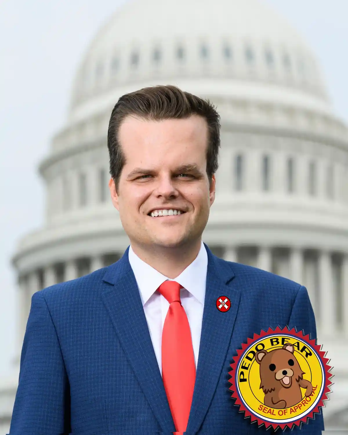 A man in a blue suit and red tie stands smiling in front of the U.S. Capitol dome. A large cartoon seal with a bear and the…
