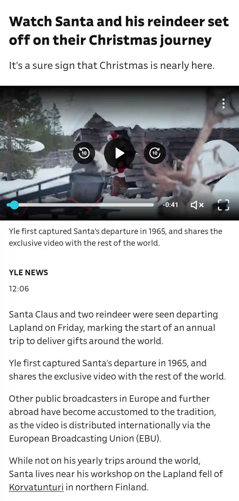 A screenshot of a YLE News article featuring a video player showing Santa Claus in a snowy, wooden cabin setting, with…
