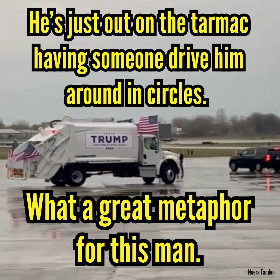 A white truck with 'TRUMP 2024' and American flags on its sides is shown driving on a wet tarmac, with a black SUV nearby…
