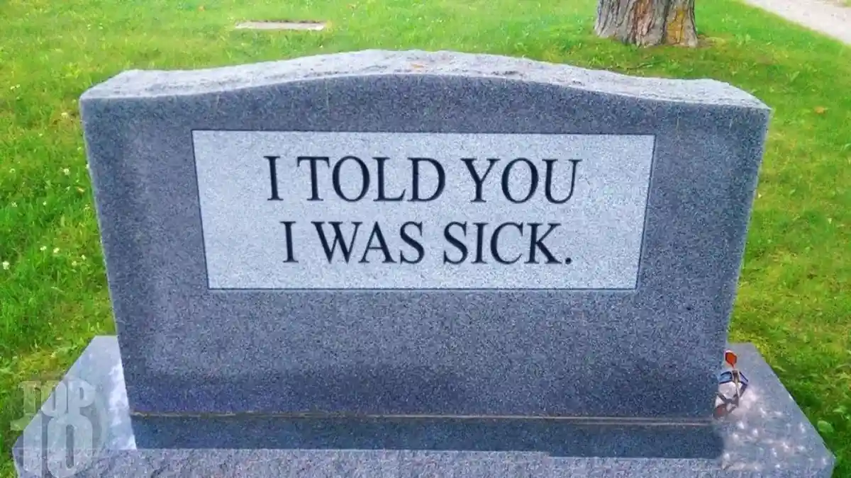 A gray granite tombstone in a grassy cemetery features the text 'I TOLD YOU I WAS SICK.' in bold black letters. A small…