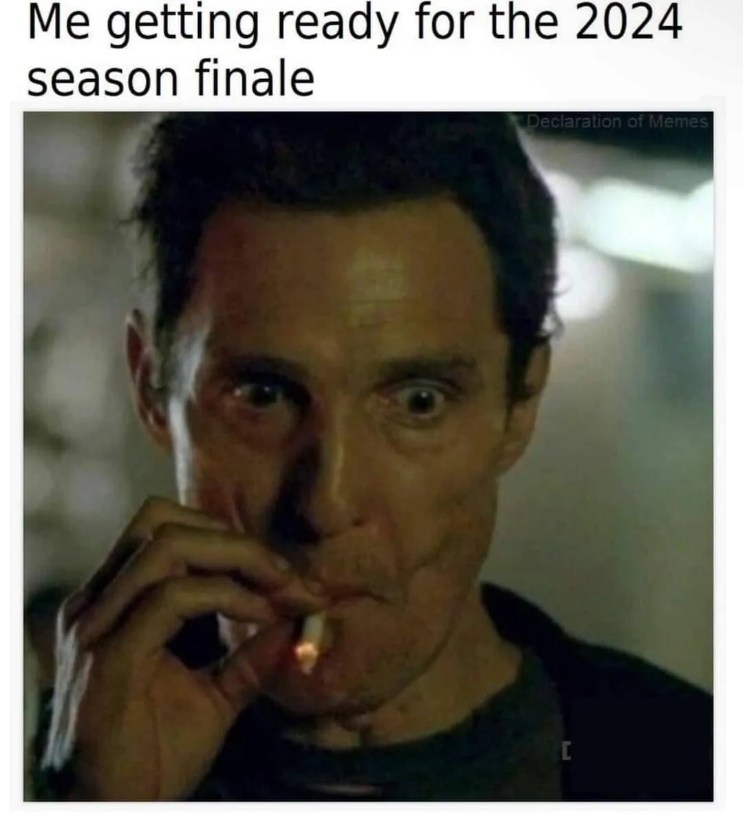 A close-up image of actor Clive Owen with a shocked, wide-eyed expression, holding a lit cigarette near his mouth. The…