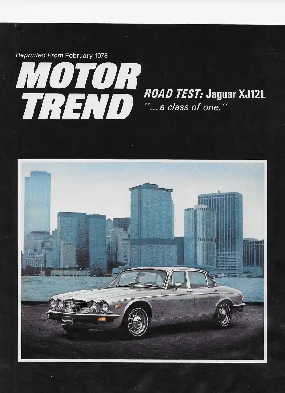 The image is a vintage Motor Trend magazine cover from February 1978 featuring a silver Jaguar XJ12L sedan parked in front…