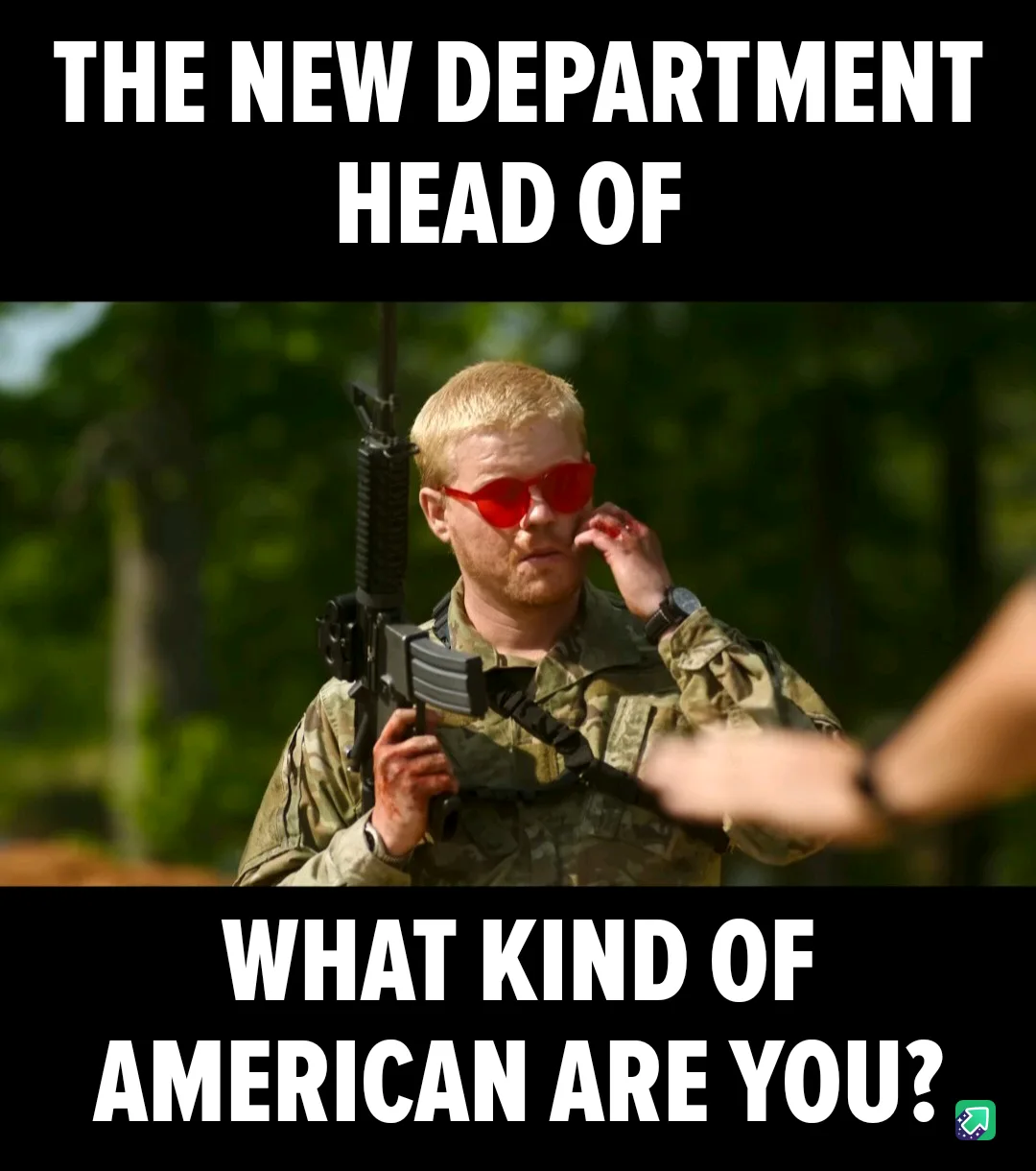 A man in military camouflage uniform holding an assault rifle and wearing red-tinted sunglasses, looking intently at someone…