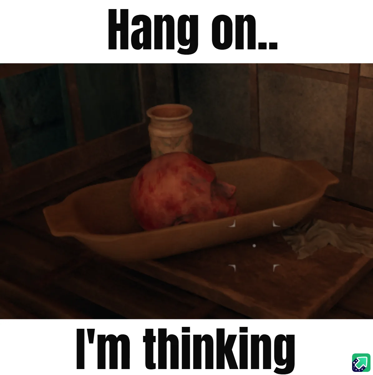 A screenshot from a video game shows a pomegranate resting in a shallow ceramic dish on a wooden surface, with a small jar…