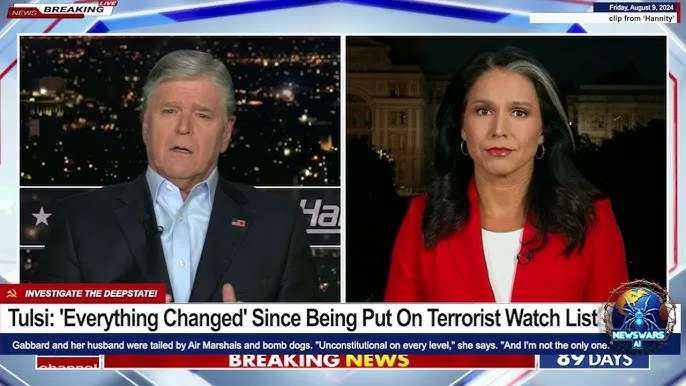 A split-screen news broadcast shows a male anchor on the left and a female anchor on the right, both looking serious. The…