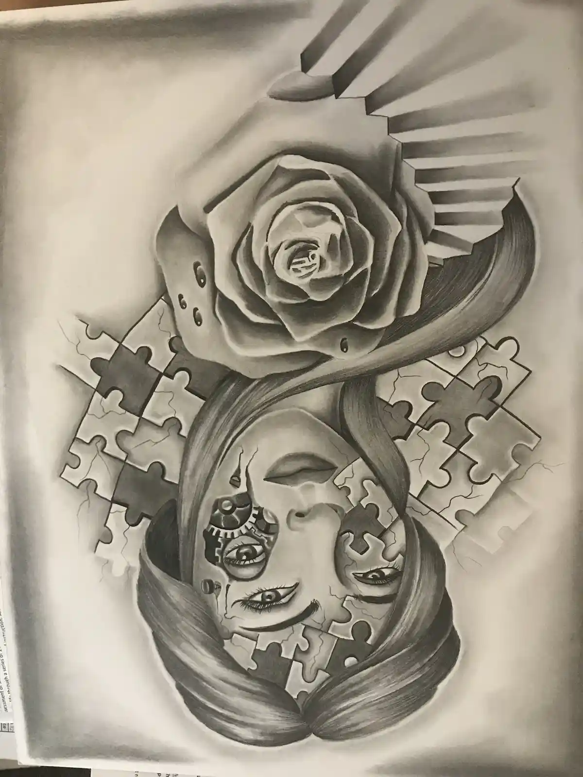 A detailed pencil drawing shows a woman's face partially composed of puzzle pieces, with a large rose above her head and…