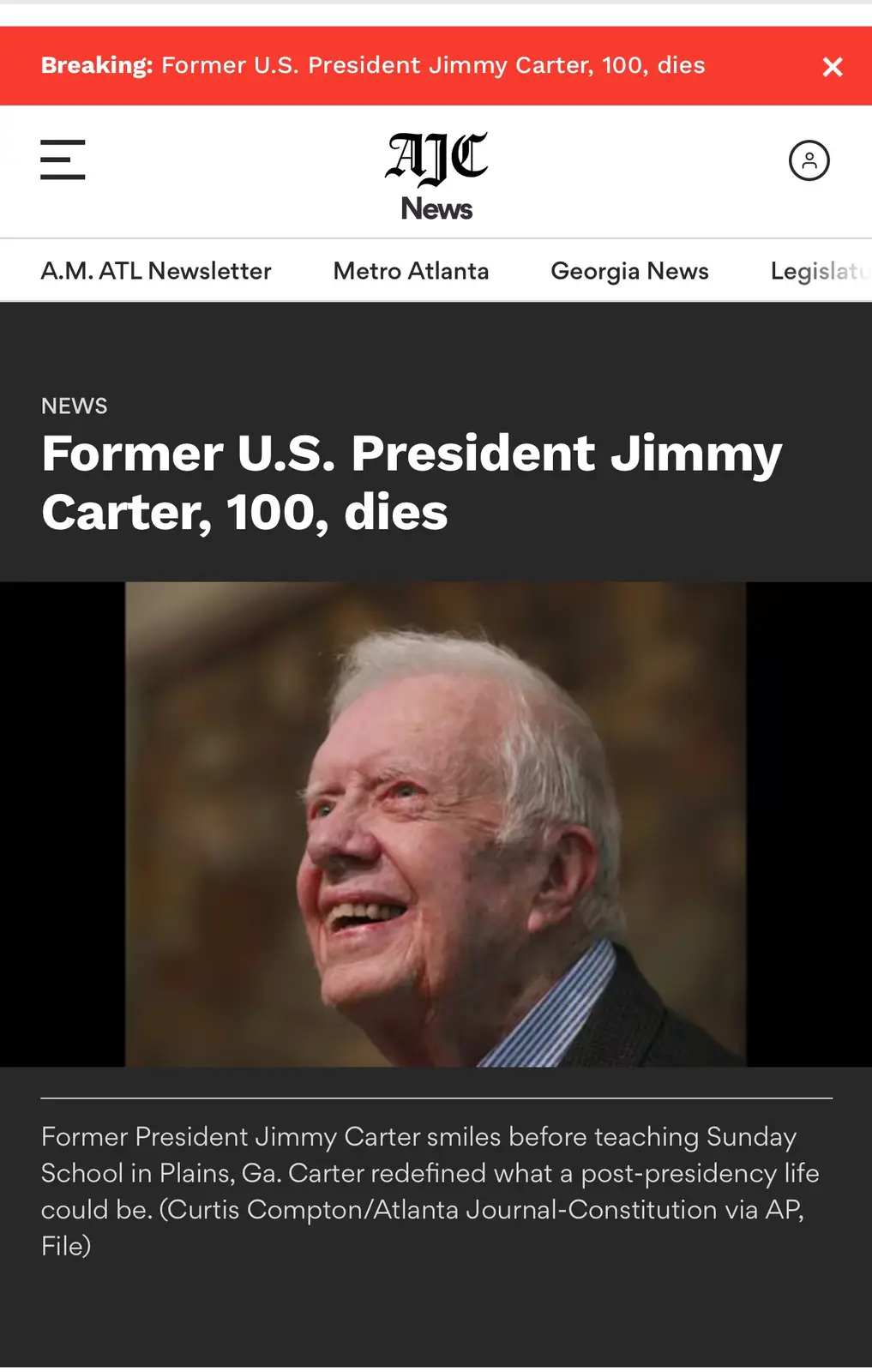 A screenshot of an AJC News article shows a smiling photo of former U.S. President Jimmy Carter, with a red banner at the…