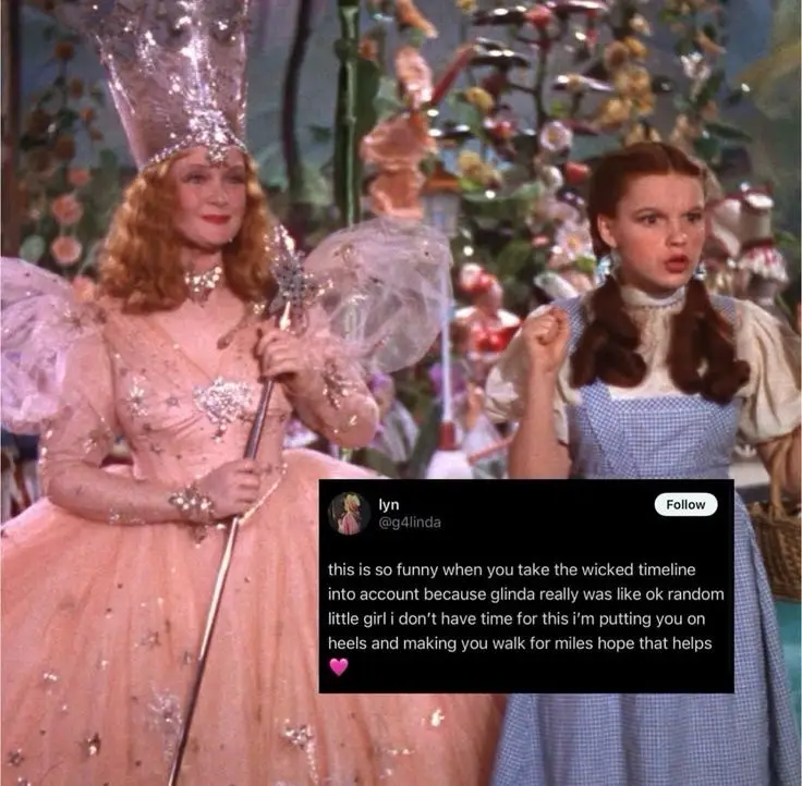 A still from 'The Wizard of Oz' shows Glinda the Good Witch in a pink gown holding a wand, standing beside Dorothy in her…