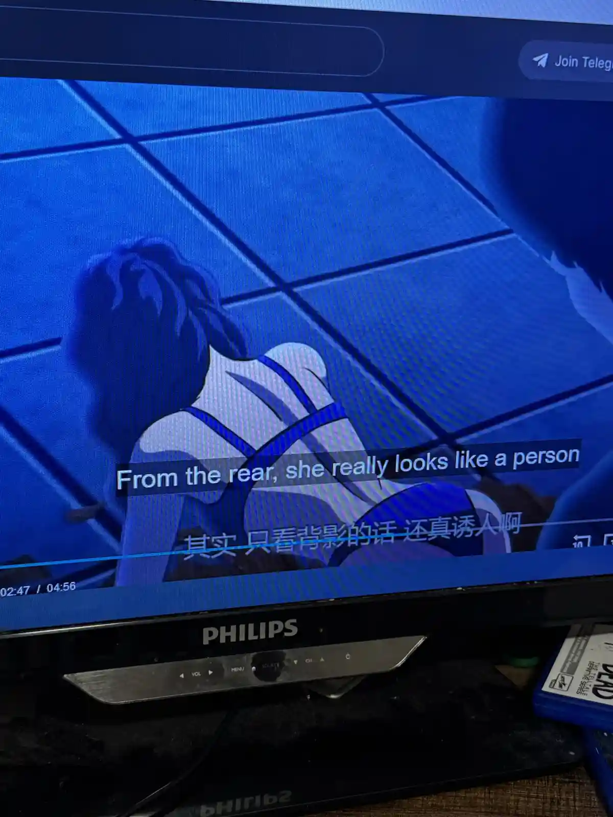 A screenshot of a Philips TV displaying an anime scene with a female character viewed from behind, overlaid with English and…