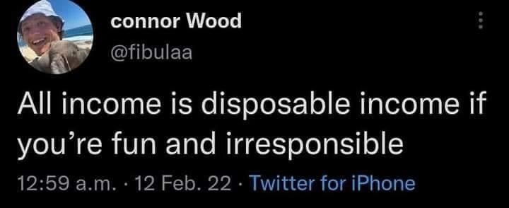 A screenshot of a tweet from user 'connor Wood' (@fibulaa) showing a smiling man in a white hat on a beach. The tweet text…