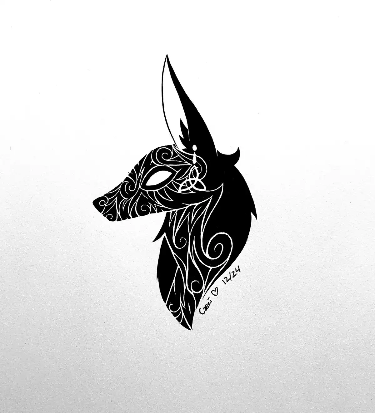 A black and white illustration of a stylized wolf head in profile, facing left, with intricate white tribal or Celtic-style…