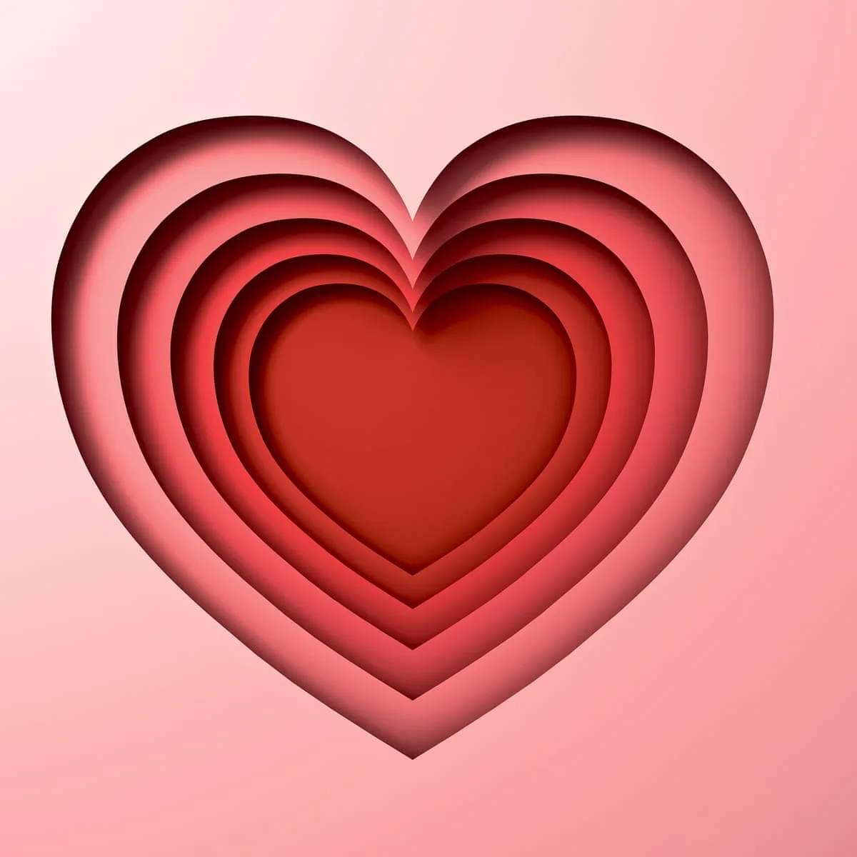 The image displays a stylized, layered heart composed of concentric red heart shapes, creating a 3D paper-cut effect against…