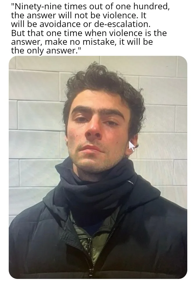 A man with dark curly hair, wearing a black puffer jacket and a black scarf, looks directly at the camera with a serious…